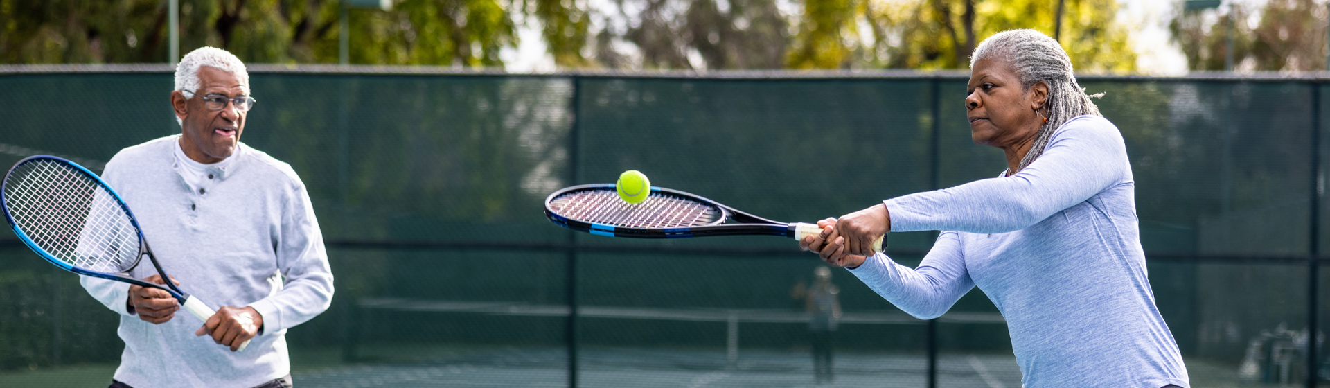 A couple playing tennis