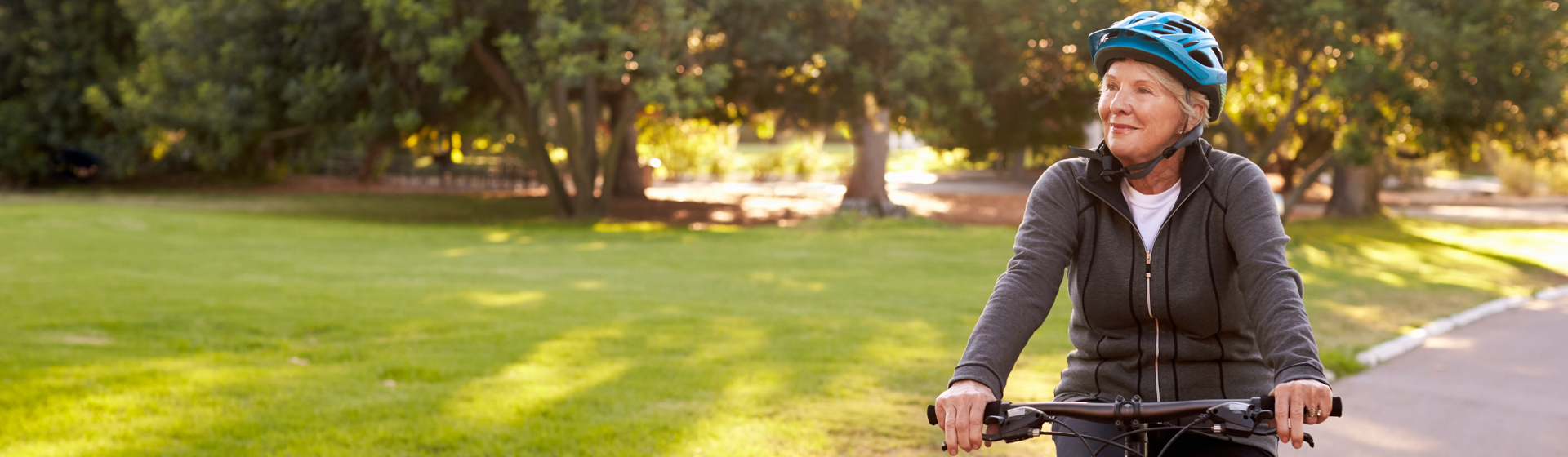 Woman riding a bike in a park